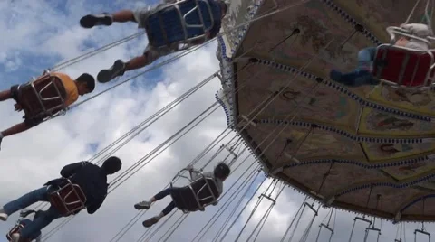 Fair Attraction Ride - Day Time - 01 - Flying Chain Wheel Stock Footage 54675103
