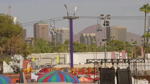 Fair with city skyline backdrop Stock Footage 253516926