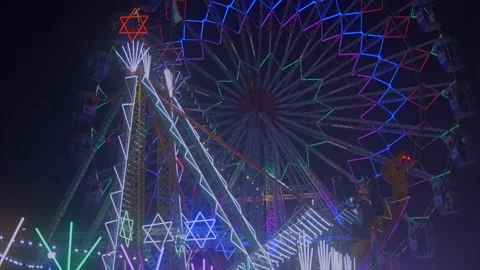 Fair ferris wheel lights decorated in mela festival in india Stock Footage 220765679