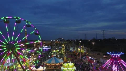 Fair lights flash as the sun goes down Stock Footage 161454219