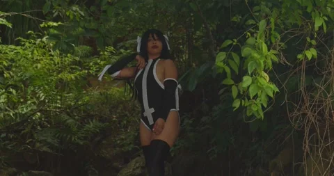 A fair-skinned cosplayer bathed in the warm glow of the setting sun, her Видео 322187261
