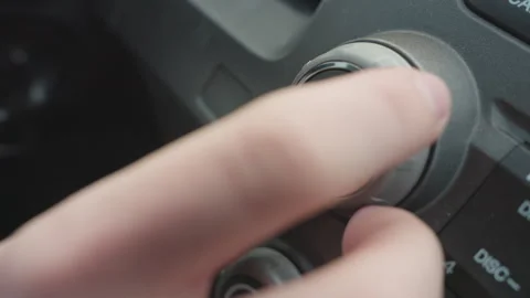 Fair Skinned Hand Pressing and Turning Car Volume Knob Vidéo 310183356