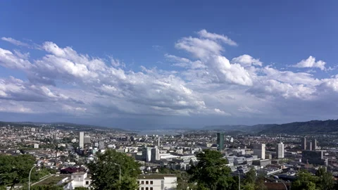 Fair-weather clouds rolling over the city of Zurich and its lake, time-lapse Stock Footage