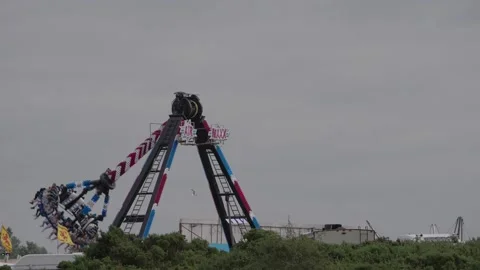 Fairground Ride Operating During Marymass Celebrations in Irvine Stock Footage 344088953