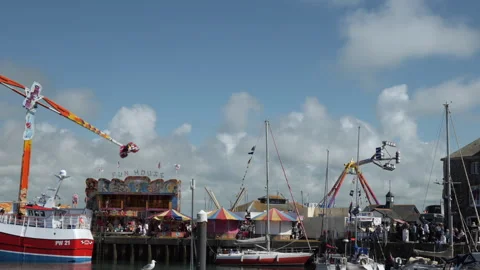 Fairground rides on padstow harbour Stock Footage 243190326