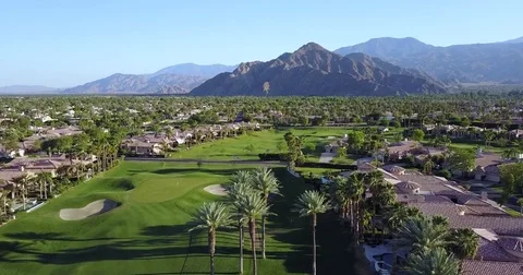 Fairway greens between desert homes in Coachella, California Stock-Footage 74734701