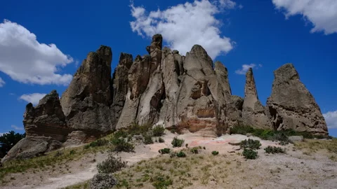 Fairy chimneys with blue sky and clouds Stock Footage 295963281