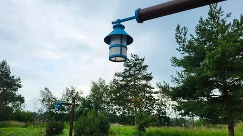 A fairy lantern hangs on a pole Stock Photos