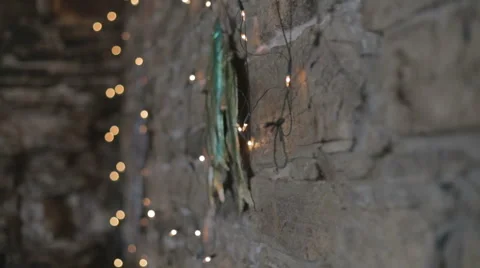 Fairy lights against brick rustic wall Stock Footage 58429549
