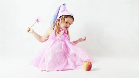 Fairy making an apple disappear Stockbeeldmateriaal 11811089