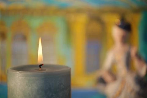 As in a fairy tale, in the almost sharp foreground a burning candle Stock Photos