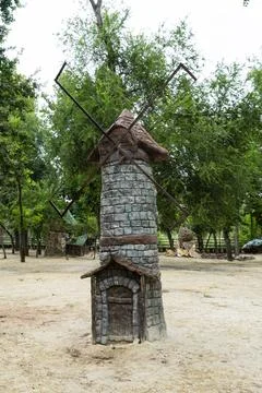 Fairy Tale Stone Windmill in Forest Theme Park Stock Photos