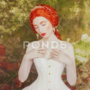 Fairytale hero. Renaissance redhead princess with hairstyle in castle. Fabulo Stock Photos