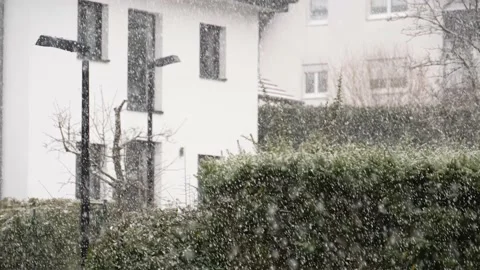 Fairytale-like slow snowfall somewhere over the roofs in the European village Stock Footage 235937722