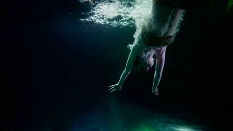 Fairytale water-nymph is diving in depth of lake or river, underwater slow 스톡 동영상 170638250
