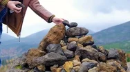 Faith And Spiritual Concept. Two People Trying To Dropping A Natural Stone On Stock Footage