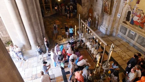 Faithful Pray Over The Stone of Unction In The Basilica Of The Holy Sepulcher Stock Footage 90580743