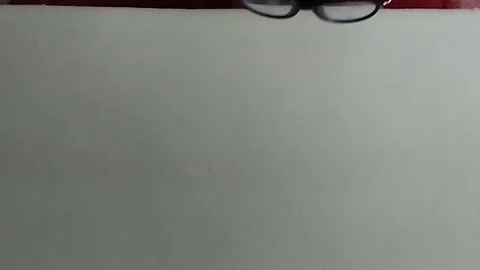 Fajri takes glasses Stock Footage 212797587