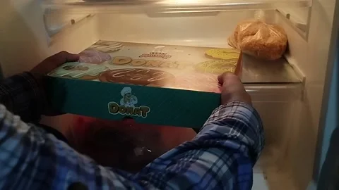 Fajri took the donut box Stock Footage 212797858