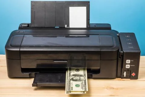 Fake banknotes printed on a printer, counterfeit concept Stock Photos