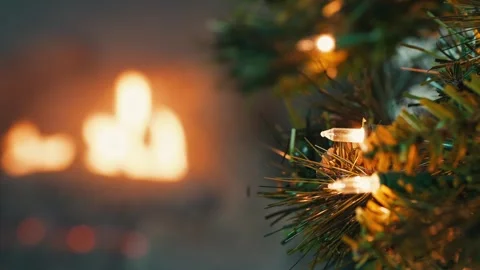 Fake christmas tree with white lights in front of fireplace Stock Footage 256597604
