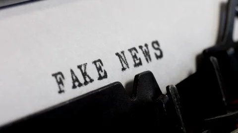 Fake News typed on an old manual typewriter. Disinformation and lies. Stock Footage