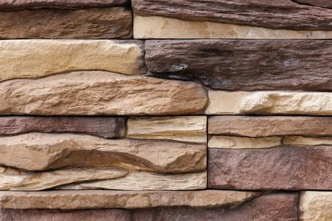 Fake stone wall, plastic panel imitating natural slab wall brickwork Stock Photos