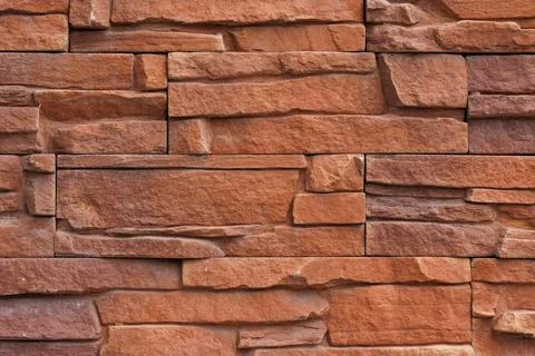 Fake stone wall, plastic panel imitating natural slab wall brickwork Stock Photos