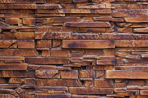 Fake stone wall, plastic panel imitating natural slab wall brickwork Stock Photos