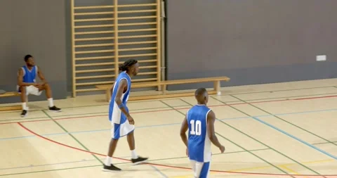 Faking drive male player passing basketball, shooting jumper on court, hugging Stock Footage 336436476