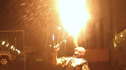 Fakir spewing fire out of his mouth Stock Footage 54457696