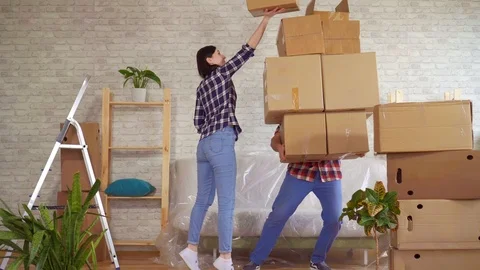 Fale man falls with boxes, problems when moving to a new apartment Stock Footage 105376693