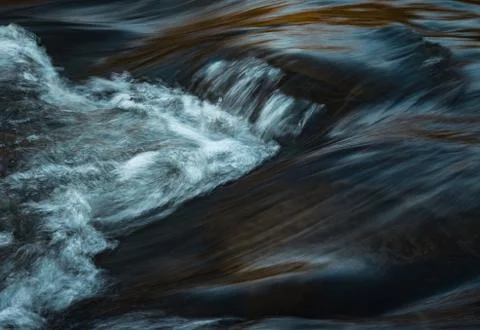 Fall blurred dark water Stock Photos