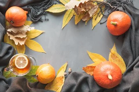 Fall border and still life, pumpkin, dry leaves, scarf for cozy and warming. 스톡 사진