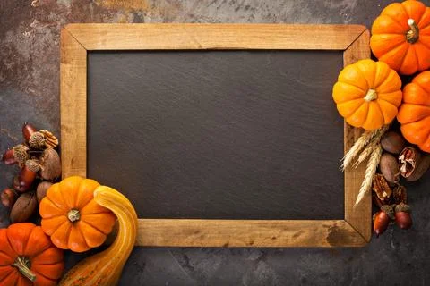 Fall chalkboard frame with pumpkins Stock Photos
