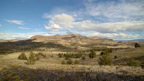 Fall clouds and shadows drift over a remote desert mountain Sutton Mountain Stock Footage 81669795