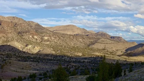 Fall clouds and shadows drift over a remote desert mountain Sutton Mountain Video stock 81670649
