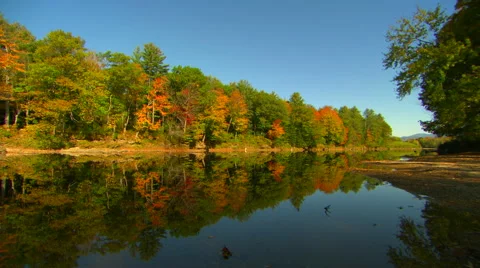 Fall colors reflected in pemigewasset river in new hampshire Stock Footage 42662775