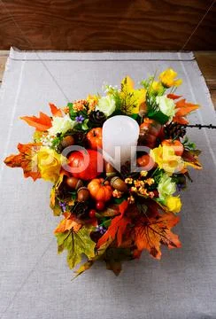 Fall Decoration With Candle And Silk Maple Leaves Vertical