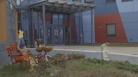 Fall decorations in front of Gilmartin Elementary School Stock Footage 304373046