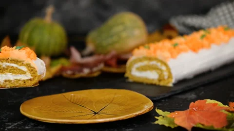 Fall dessert pumpkin roll with cream cheese. Bakery, frosting. Stock Footage 119222358