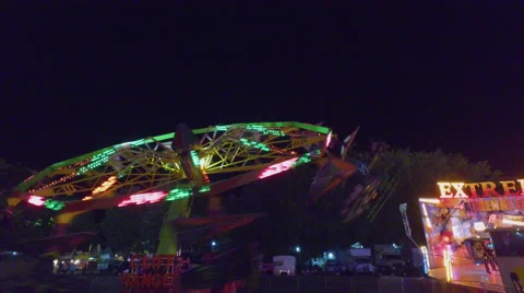 Fall Fair Wide shot panning down as paraglide carnival ride comes to a stop 스톡 동영상 68987451