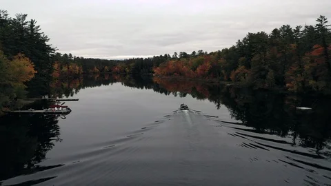Fall Foliage Kezar Lake boat follow dock Stock Footage
