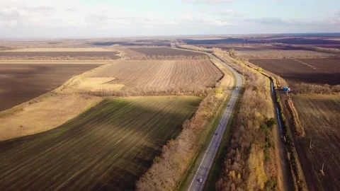 Fall landscape. Road under blue clear sky. Transportation background. Travel Video stock 168149338