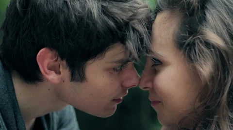 Fall in love, loving couple caressing, eye contact, kissing her nose, tenderness Video stock 28381548