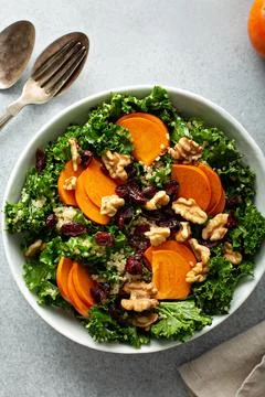 Fall or winter salad with persimmon and kale Stock Photos