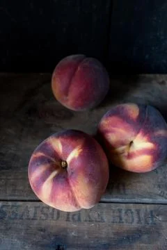 Fall peaches in rustic setting Stock Photos