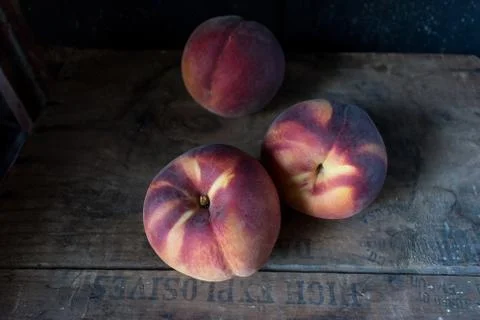 Fall peaches in rustic setting Stock Photos