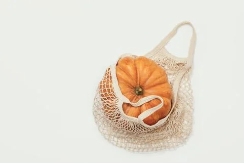 Fall pumpkin in a shopping bag Stock Photos