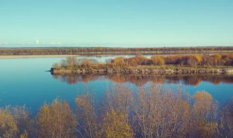 Fall River, reflected in the water autumn trees. Fotos de archivo